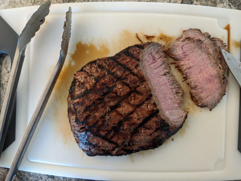 Flank steak on cutting board