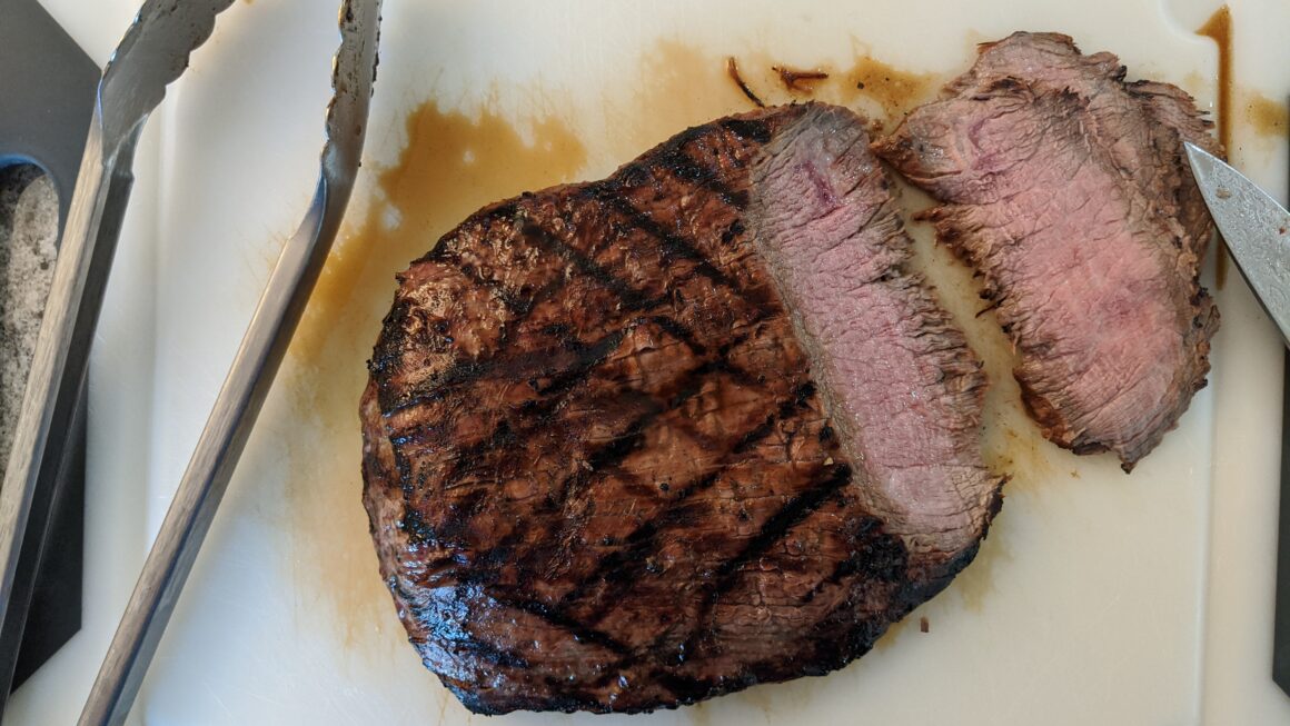 Flank steak on cutting board