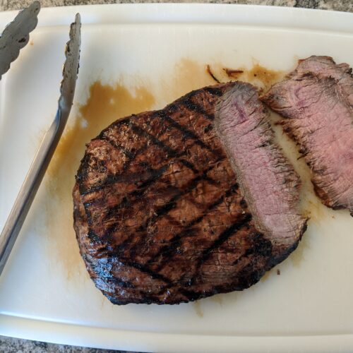 Flank steak on cutting board